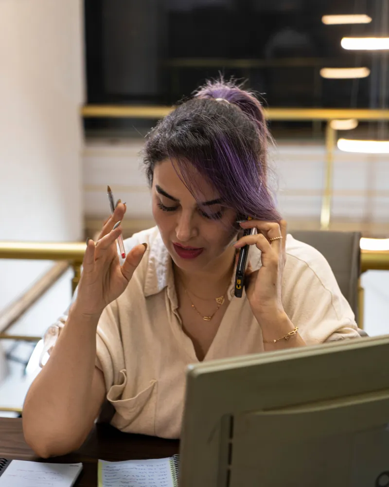 Assistant on a phone call at her desk